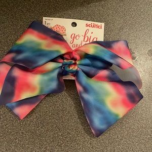 Scunci Go big and go bow rainbow bow. Brand new. Never warn. New